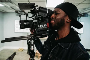 black man with red dragon camera
